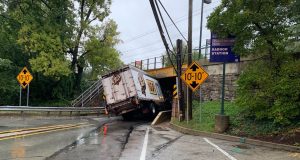 Truck Gets Wedged Under Rail Bridge Near Schools on Main Line