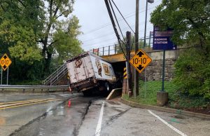 Truck Gets Wedged Under Rail Bridge Near Schools on Main Line