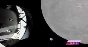 NASA capsule buzzes moon in last big step before lunar orbit