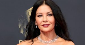 Catherine Zeta-Jones Steps Out in a Button-Up Red Leather Skirt