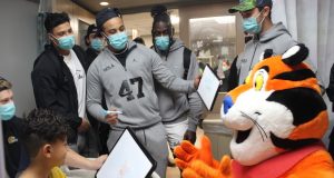UCLA football team visits patients at Las Palmas