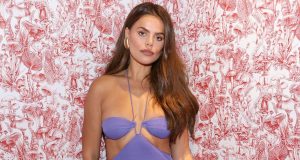 Brooks Nader Enjoys Dreamy Beach Vacation in a Figure-Hugging Halter Dress