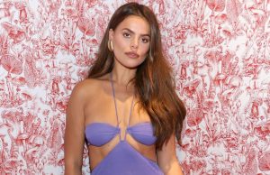 Brooks Nader Enjoys Dreamy Beach Vacation in a Figure-Hugging Halter Dress